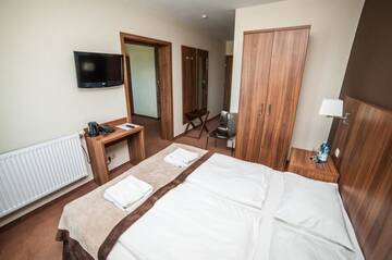Фото номера Номер-студио (4 взрослых) Отель Hotel Zawrat Ski Resort &amp; SPA г. Бялка-Татшаньска 3