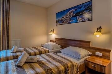 Фото номера Двухместный номер с 1 кроватью Отель Hotel Liptakówka г. Бялка-Татшаньска 5