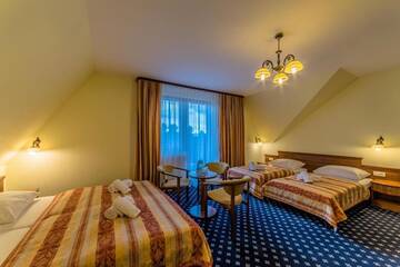 Фото номера Четырехместный номер Отель Hotel Liptakówka г. Бялка-Татшаньска 4
