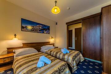 Фото номера Небольшой двухместный номер с 2 отдельными кроватями Отель Hotel Liptakówka г. Бялка-Татшаньска 2