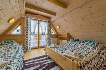 Фото номера Дом с 2 спальнями Шале Domek w Białce г. Бялка-Татшаньска 51