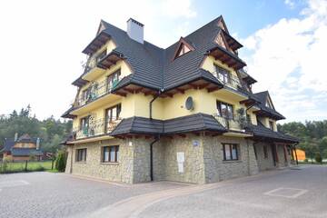 Фото номера Апартаменты с 2 спальнями Апартаменты Apartament Cztery Pory Roku г. Бялка-Татшаньска 13