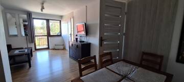 Фото номера Просторные апартаменты с 2 спальнями и камином Апартаменты Apartamenty Bajka Białka Tatrzanska z Kuchnią г. Бялка-Татшаньска 2
